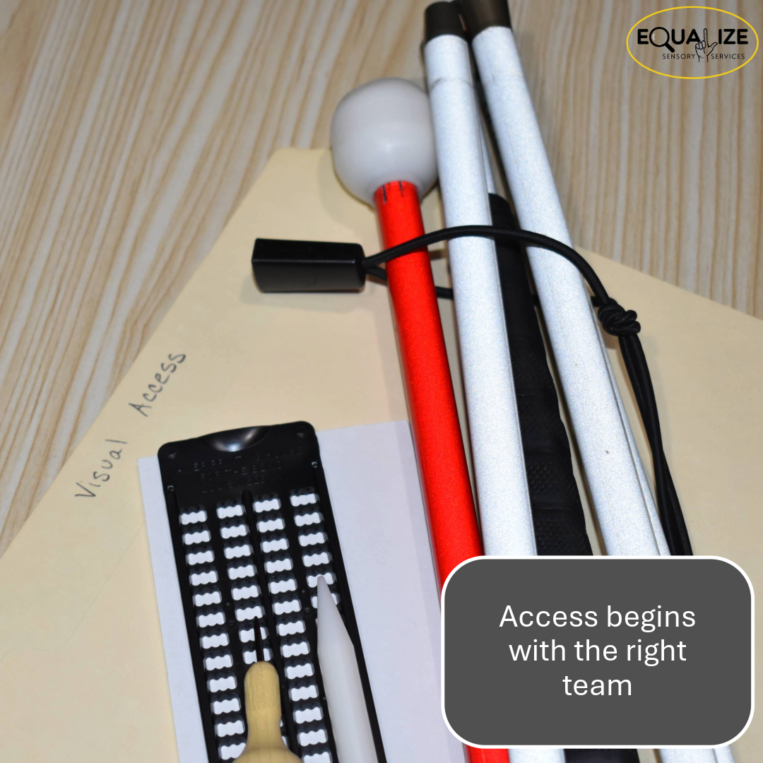  Folder labeled Visual Access with braille slate, stylus, eraser, and white cane arranged on a desk surface